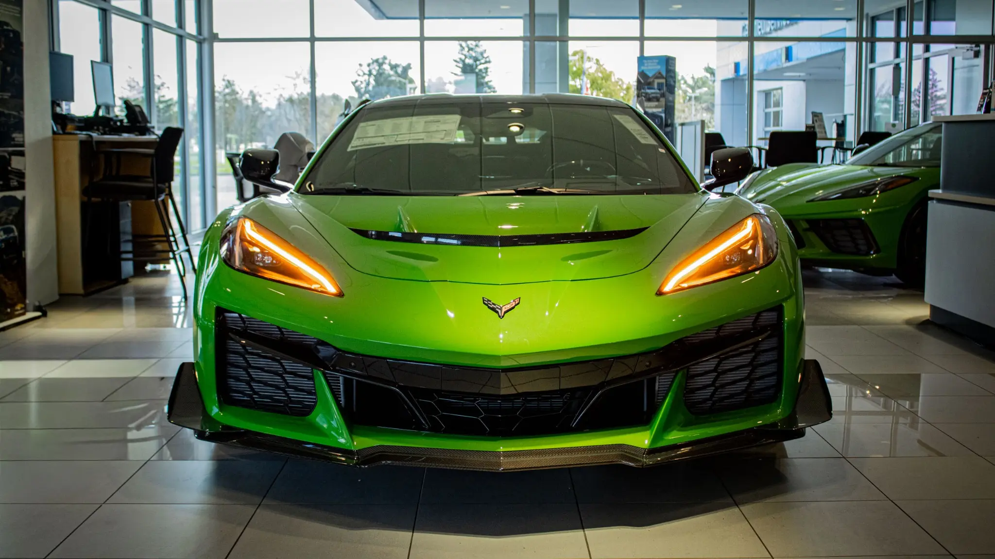Green Corvette photographed by CARSVIVO in the showroom